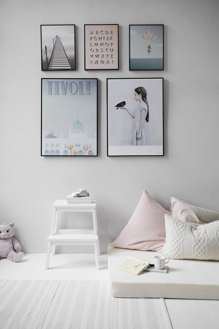 summer-sale Minimalist Scandinavian bedroom with wall art and cozy decor elements.