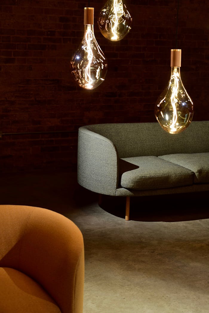 faq-img Elegant modern living room with designer lighting and minimalistic furniture.
